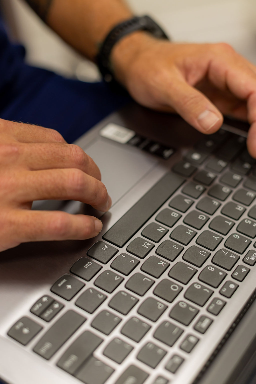 Steadfast physician documenting clinical findings on a laptop